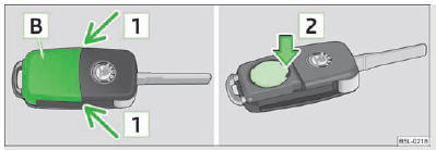 Fig. 9 Clé à radiocommande - enlever le couvercle/sortir la pile